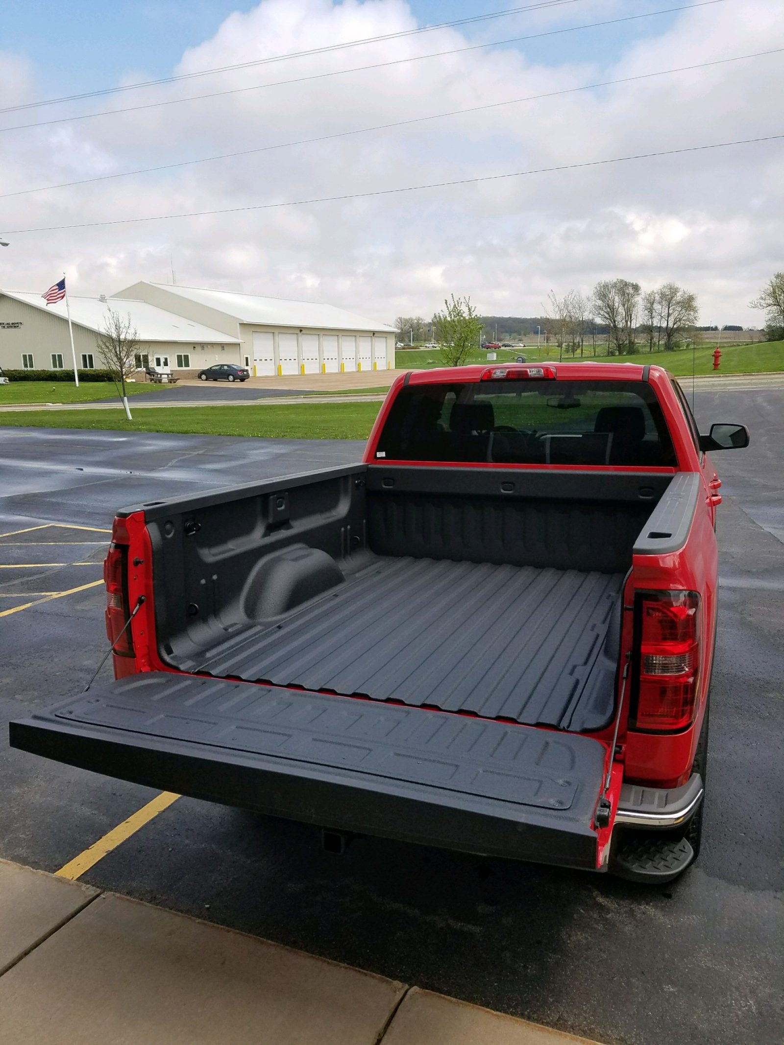 Fleet truck with protective polyurea coating on bed and underbody